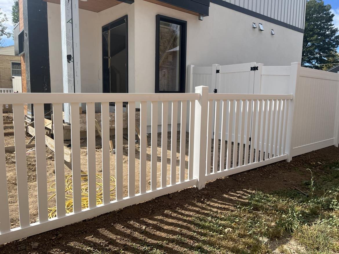 A white vinyl fence